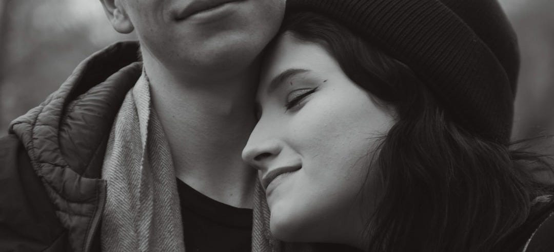a man and a woman are embracing each other a man and a woman are embracing each other