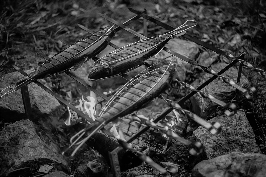Three fist in metal straight jackets cook on a twisted metal grill Three fist in metal straight jackets cook on a twisted metal grill