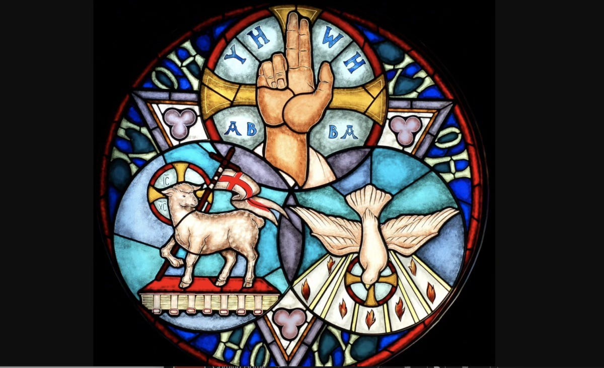 A stained glass window with symbols

Description automatically generated