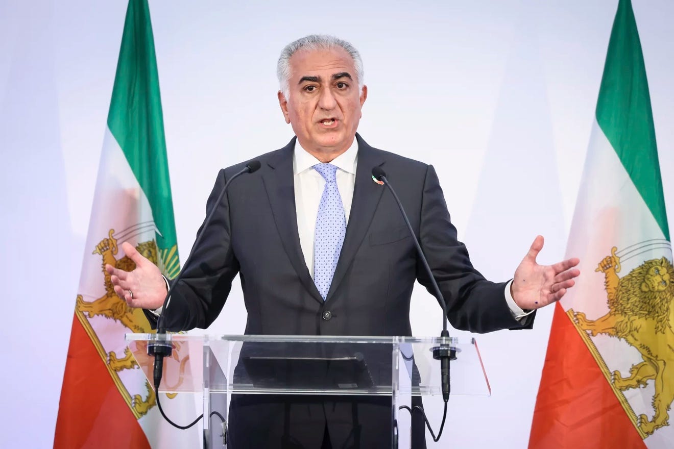 A person standing at a podium with flags behind him

AI-generated content may be incorrect.