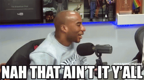 a man sitting in front of a microphone with the words nah that ain t it y'all