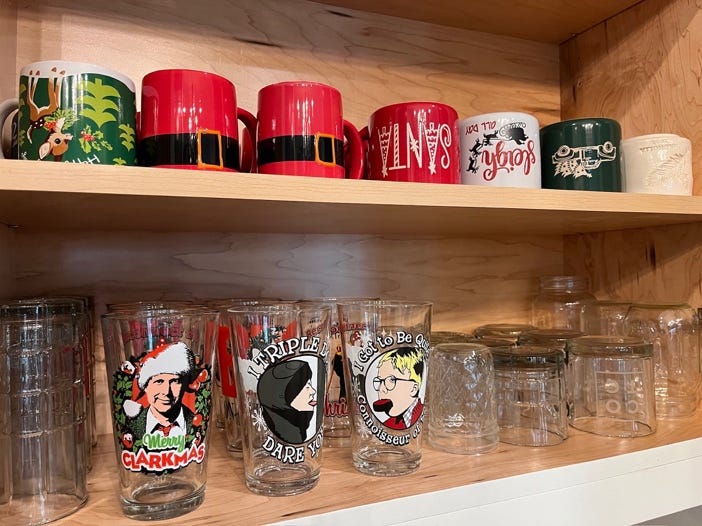 A shelf with mugs and glasses

AI-generated content may be incorrect.