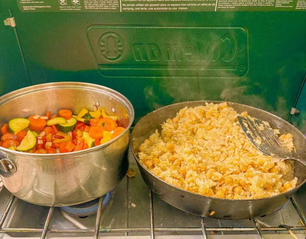 Rosemary Chickpea hash on a coleman stove, a camping meal idea for a large group