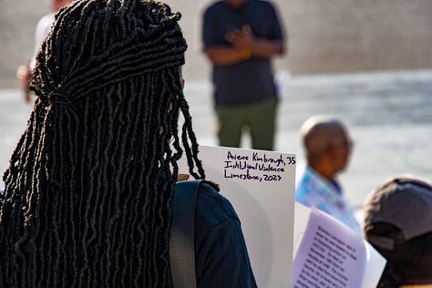 Citizens gather for a vigil to remember loved ones who have died in Alabama's prisons