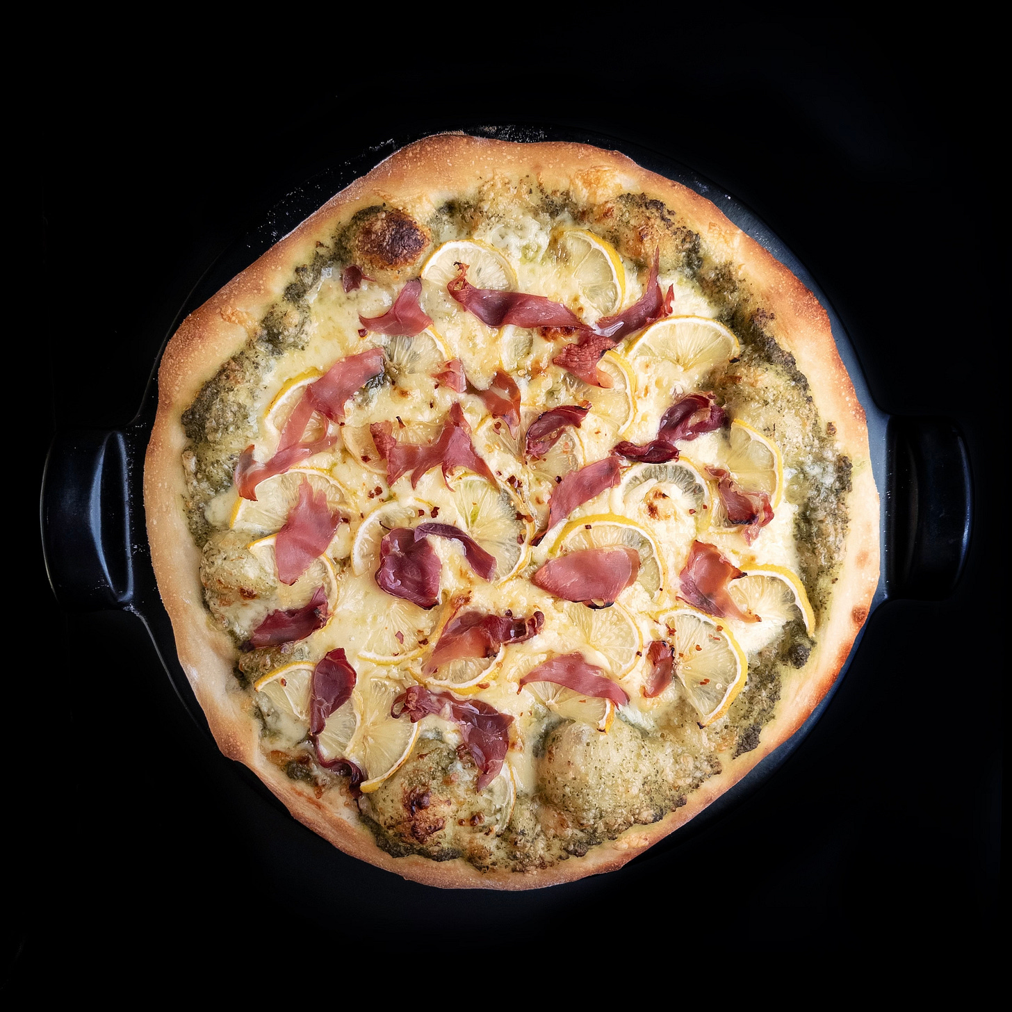 Lemon Pizza with Pesto, Prosciutto, and Smoked Gouda
