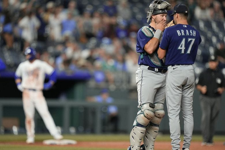 Seattle Mariners relief pitcher Matt Brash (47) and catcher Cal Raleigh meet on the mound during the ninth inning of a baseball game against the Kansas City Royals Monday, Aug. 14, 2023, in Kansas City, Mo. The Royals won 7-6. (Charlie Riedel / The Associated Press) Seattle Mariners relief pitcher Matt Brash (47) and catcher Cal Raleigh meet on the mound during the ninth inning of a baseball game against the Kansas City Royals Monday, Aug. 14, 2023, in Kansas City, Mo. The Royals won 7-6. (Charlie Riedel / The Associated Press)