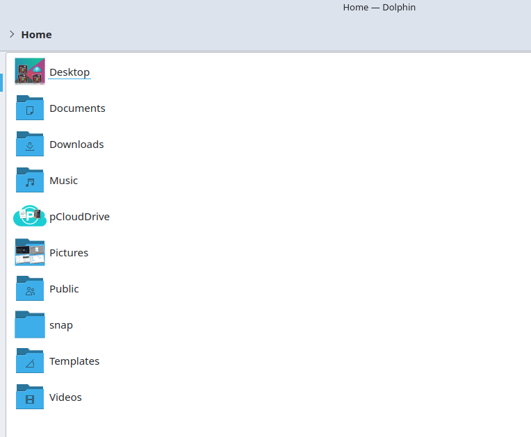 The Dolphin file manager open to the Home folder on a Linux desktop, showing the pCloud Drive icon as a standard folder for quick access.