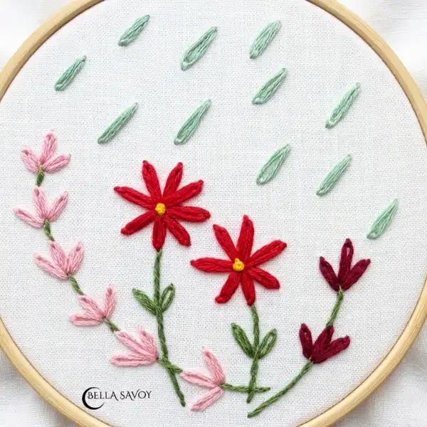 lazy daisy flowers and raindrops on hooped fabric