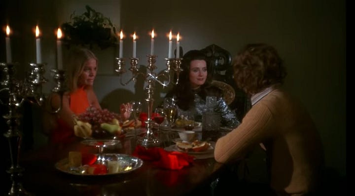 left: A still from Daughters of Darkness where a blonde in a silver sequin gown sits with a man in a red robe to her left and his blonde wife sits to her left. They are at a table with silver servwear and tall candlesticks. On the right, a brown-haired woman in a silver sequined dress sits between a blond woman (to her right) and her husband (to her left), they all sit at a dinner table with silver platters and tall candlesticks.
