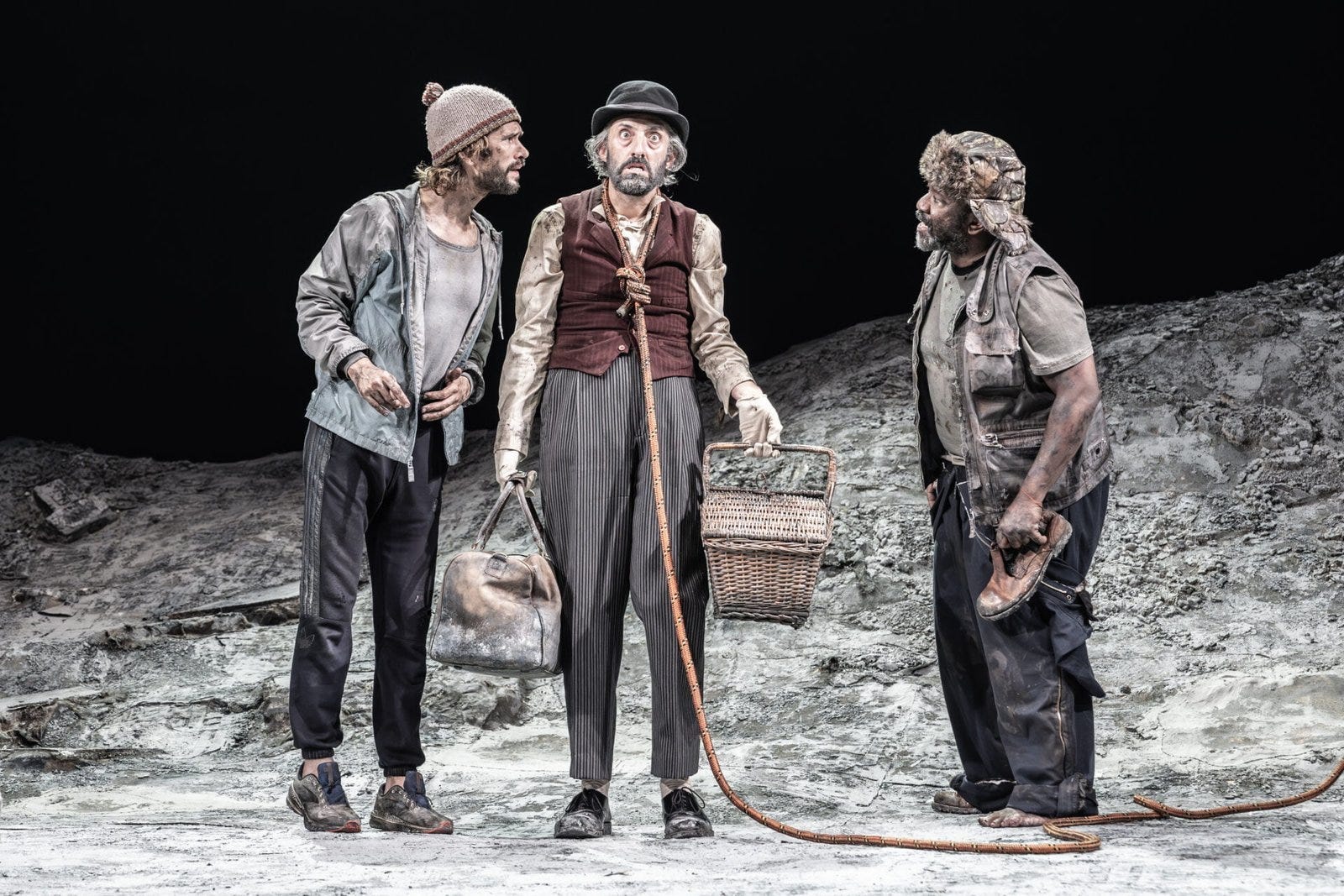 Vladimir and Estragon stare at a motionless Lucky in ‘Waiting for Godot.’