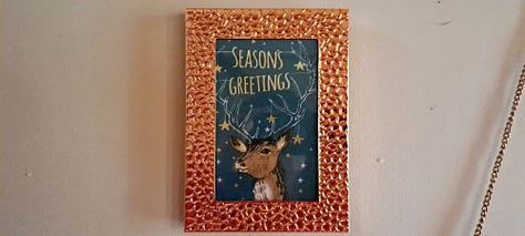 Six photos of stag decorations. 1. cushion with stag head; 2. 2 small black wooden deer ornaments; picture in frame of stag against blue background with message 'Season's Greetings'; white wooden stag figure; two silver stags facing each other with their antlers as candleabra; delicate white ceramic stag tree decoration.