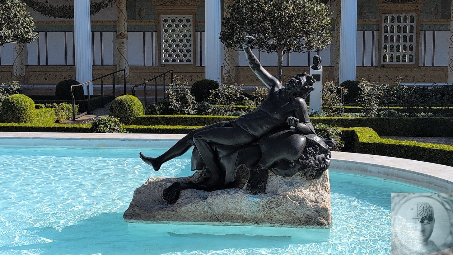 satyr with a wine cup statue in the water feature peristyle garden in Getty Villa
