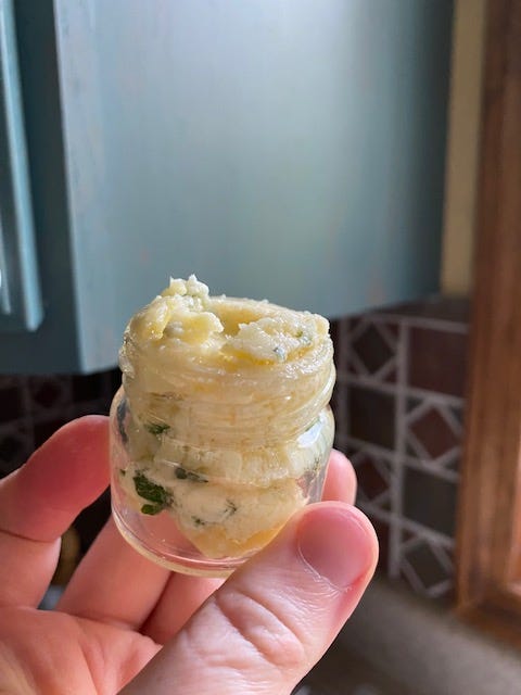 honey butter in a one-ounce glass jar