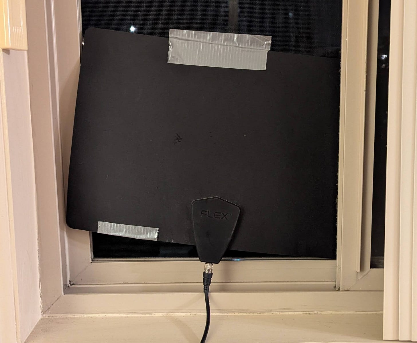 A digital antenna for a TV stuck in a window