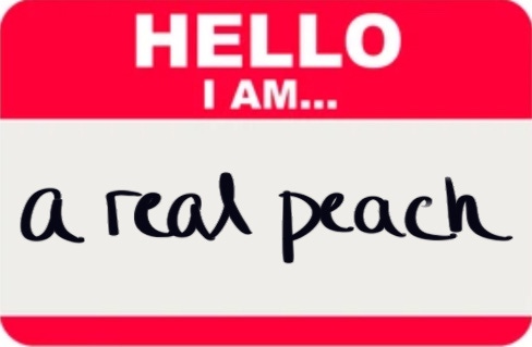 red and white name tag that reads, "HELLO I AM... a real peach"