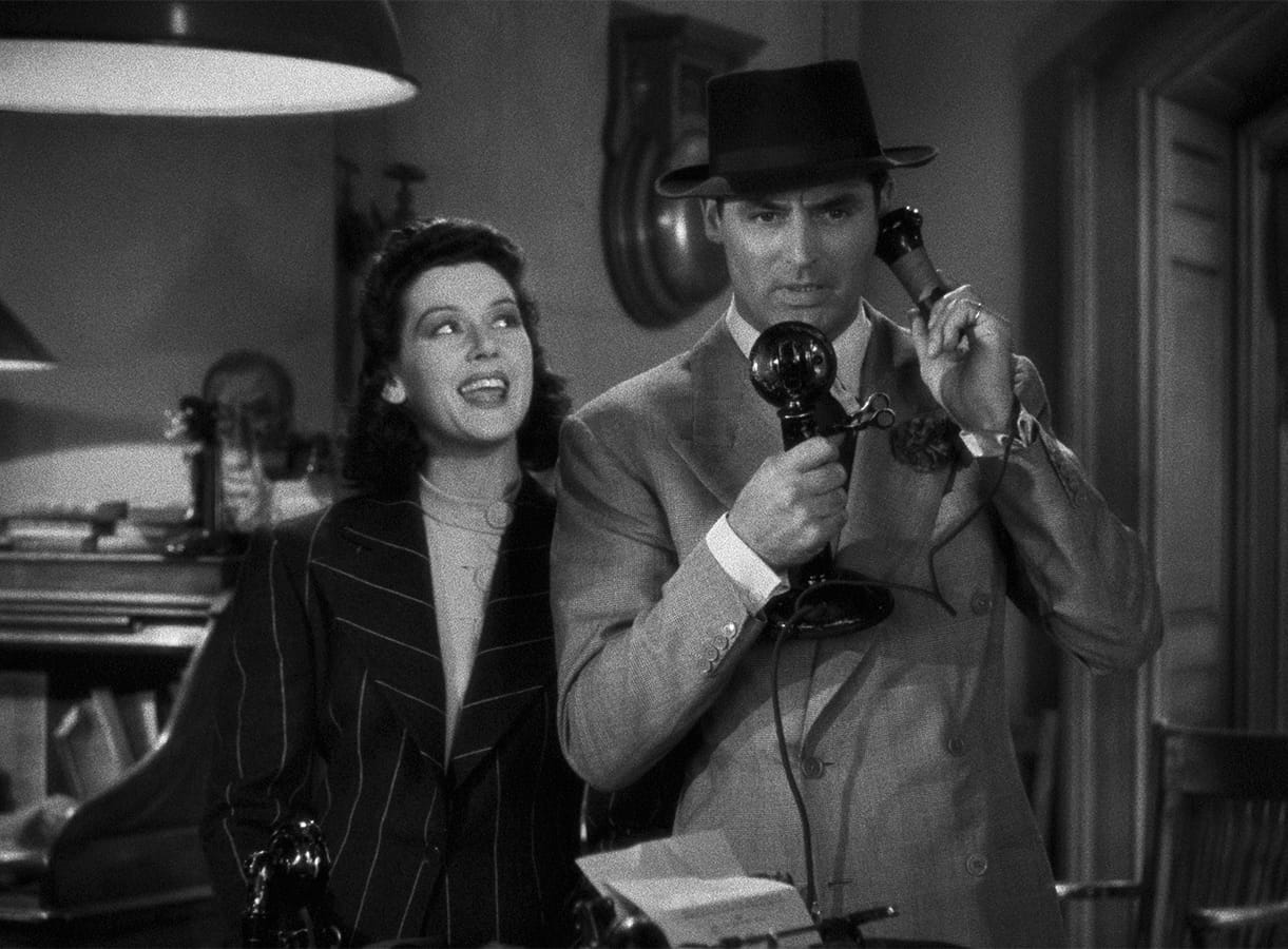 His Girl Friday | Still features Cary Grant over the phone while Rosalind Russell is next to him.