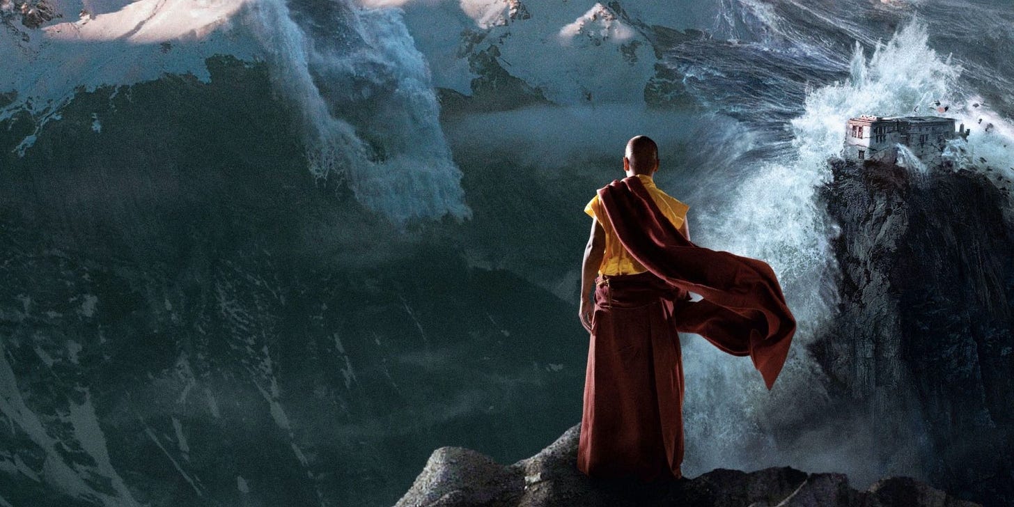 Movie still from 2012. A Tibetan monk stands on a mountain, watching a huge flood of waves crash over a building.