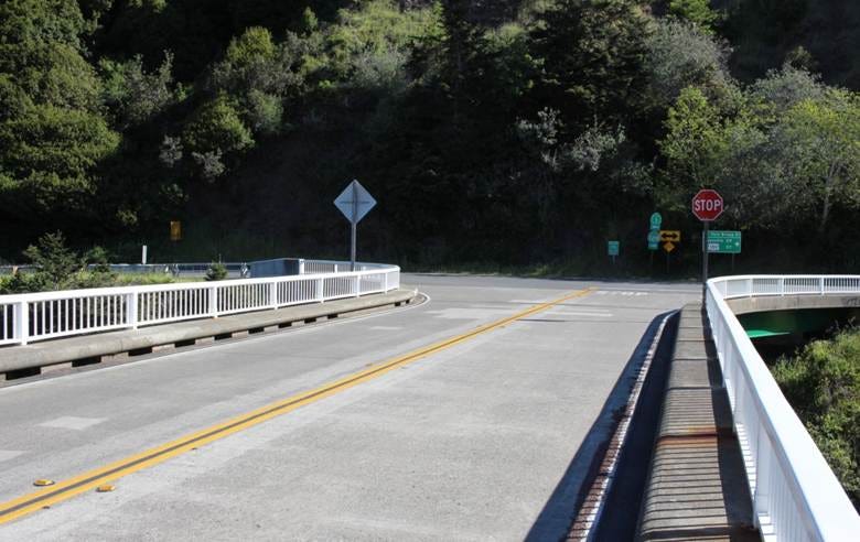 A road with a stop sign

AI-generated content may be incorrect.