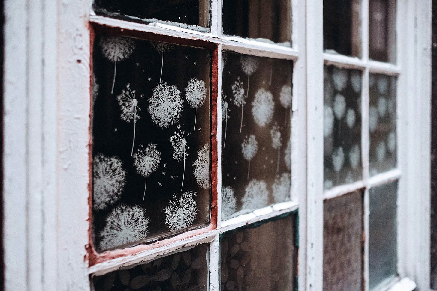 A window that has frost on the inside of it