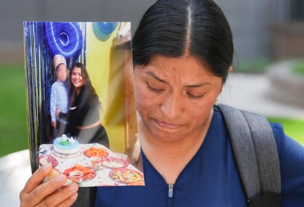 Maria Chipantiza holds a photo of her daughter, Jocelyn Chipantiza, 20, who was taken into Federal custody last week at the Jacob K. Javits Federal Building. 