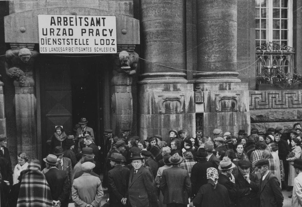 Photo of Polish citizens signing up for employment at a German established Arbeitsamt (labour office) in occupied Łódź. Poles were promised acceptable conditions and wages if they went to work in Germany, but they were abused and rarely paid. (1939)