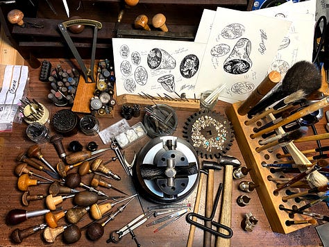 A ring by Jasmine Ataullah, Castro Smith's workbench, Emefa Cole with a ring.