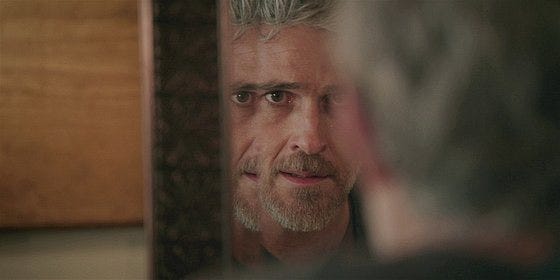 Dan looking at his twisted reflection in mirror on Walker. Dan looking at his twisted reflection in mirror on Walker.