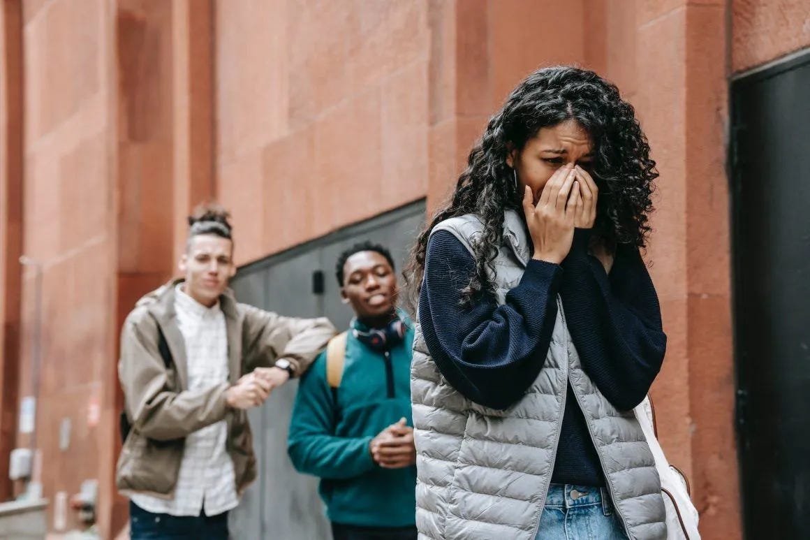 multiethnic male students gossiping about sad crying woman multiethnic male students gossiping about sad crying woman