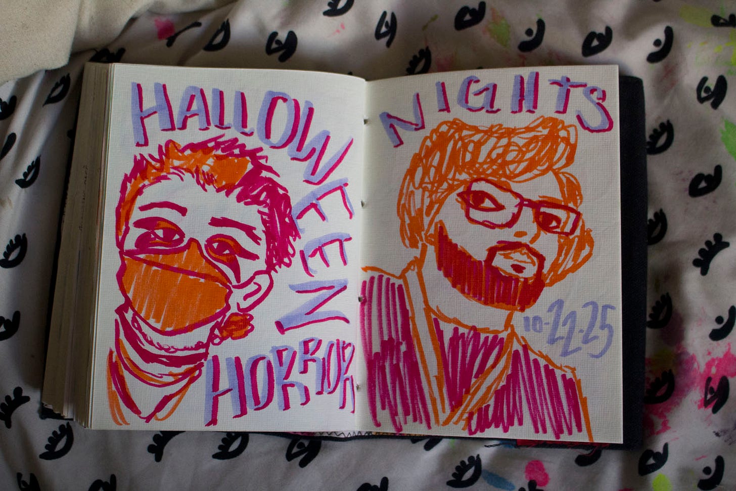 a drawing of two people, with the text "halloween horror nights"