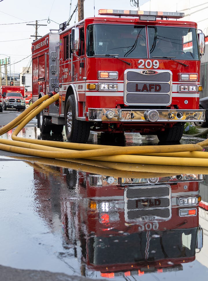 images of firemen working a fire in downtown LA's produce district
