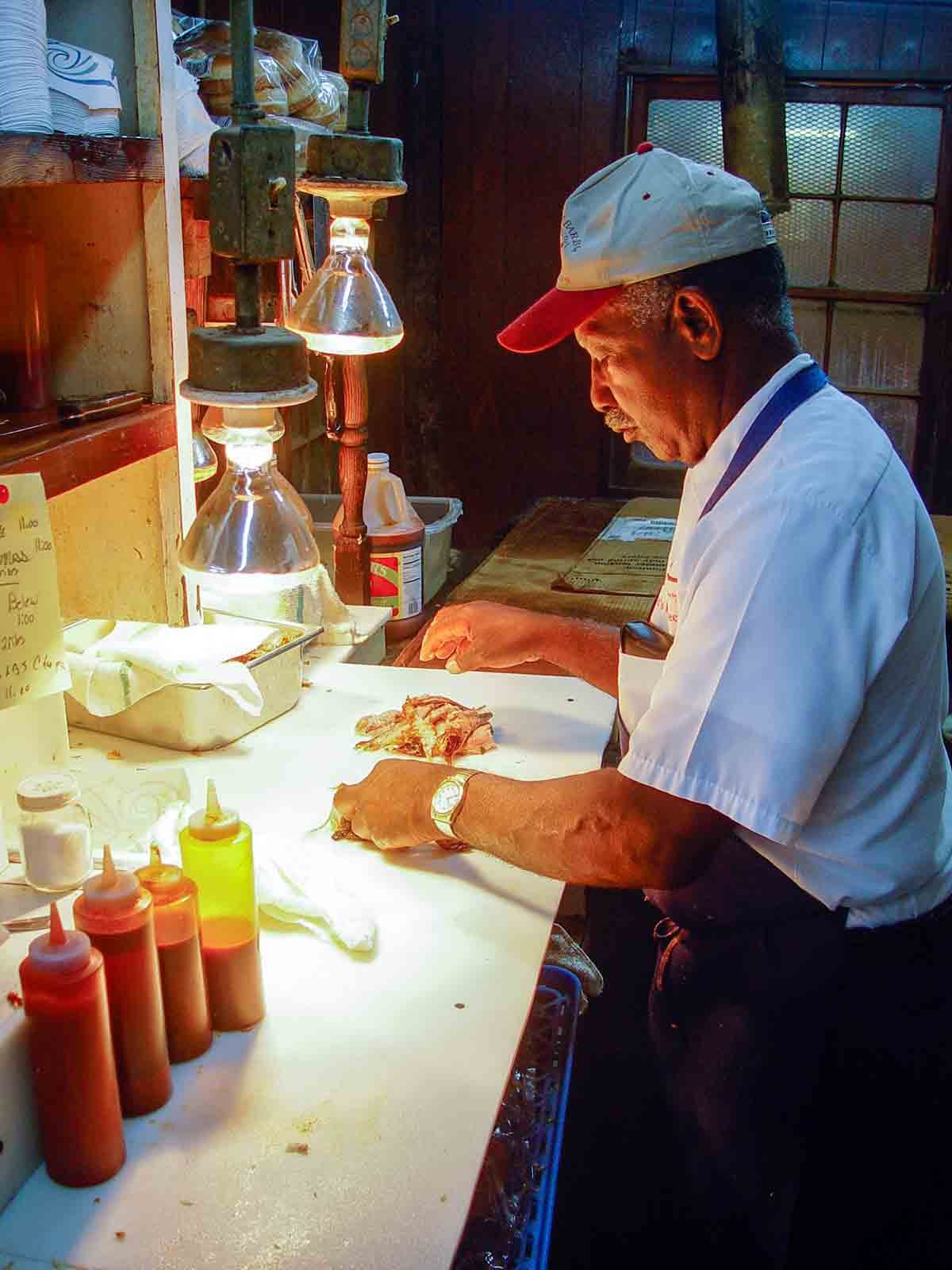 Mr. Carver assembling David's pull-pork sandwich Mr. Carver assembling David's pull-pork sandwich