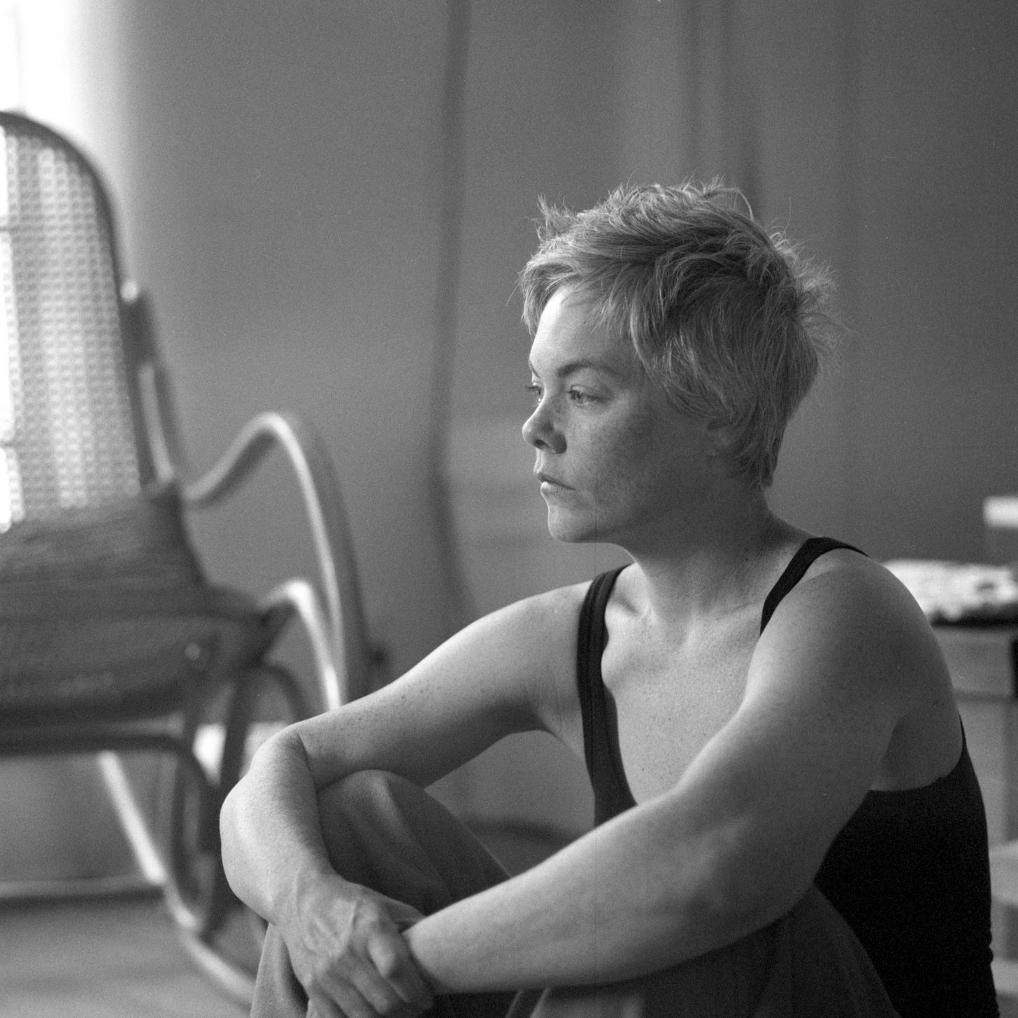 A black and white portrait of the author looking into middle distance. 