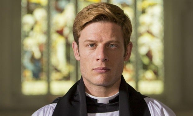 A front facing shot of the vicar, Sidney Chambers, from Grantchester. He is white with reddish hair, and may or may not be hot.
