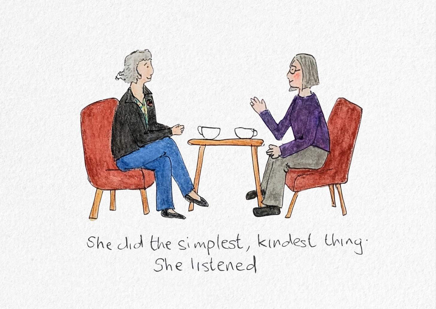 This illustration shows two women sitting together in a coffee shop, talking. They sit opposite each other on red chairs with a small wooden table between them, holding two empty coffee cups. One woman has short grey hair and wears a black jacket with a green top and blue jeans; the other has a grey bob, glasses, a purple jumper, and grey trousers. Their posture is relaxed and open, capturing a gentle moment of deep listening and connection. The handwritten text beneath the image reads: “She did the simplest, kindest thing. She listened.” This artwork accompanies a blog post about the healing power of being heard.