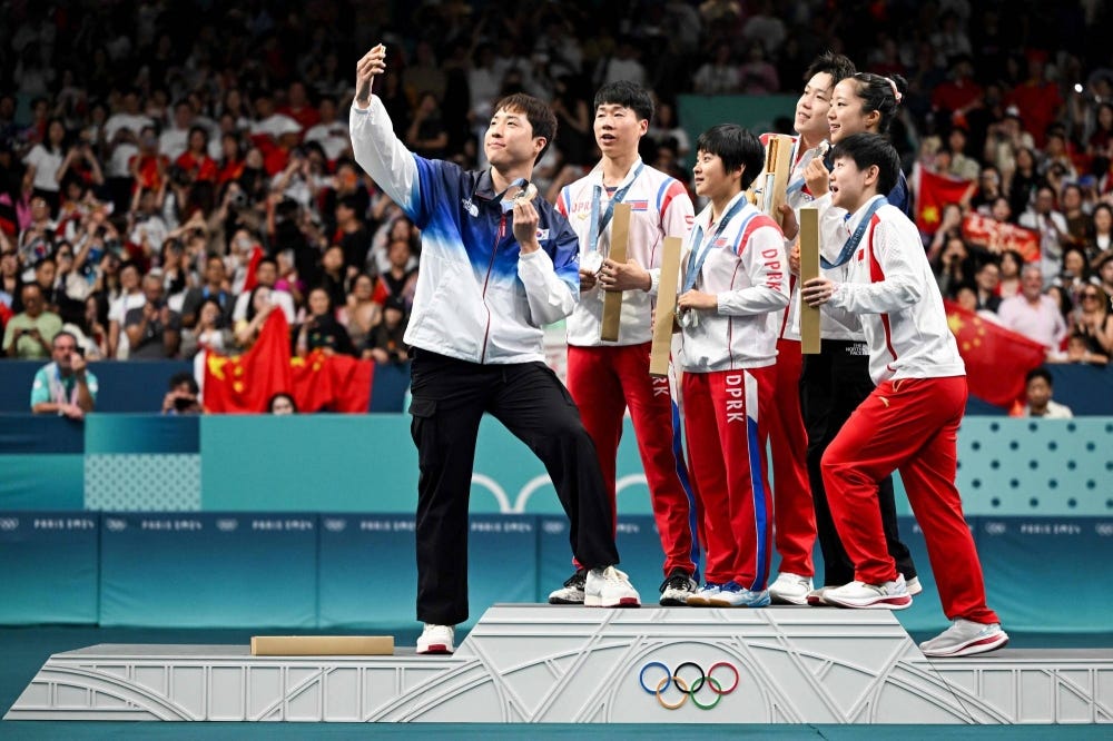 North-South Korea Olympic podium selfie goes viral - The Japan Times