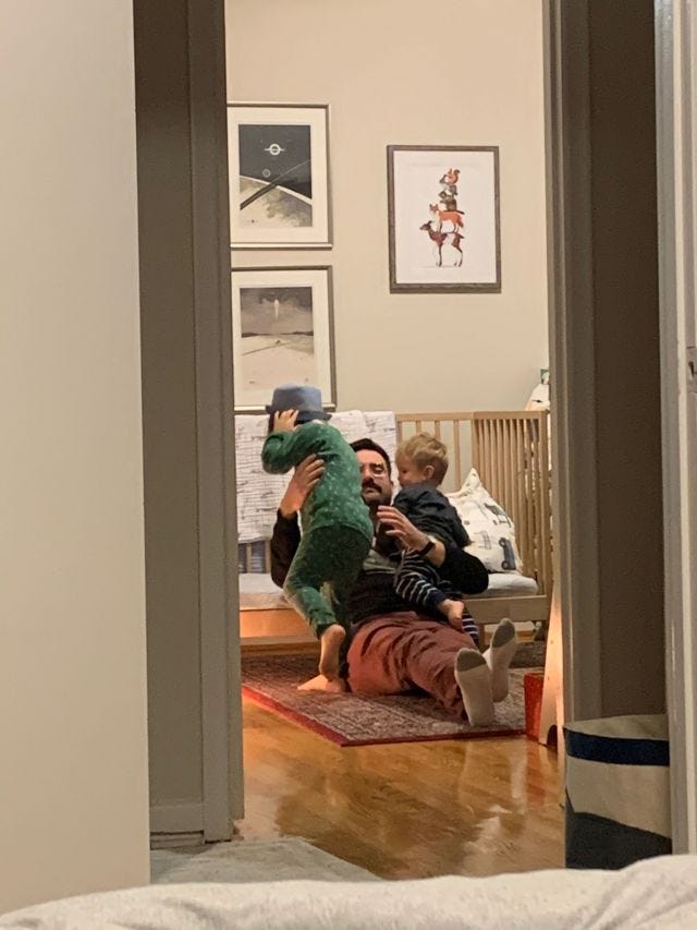 I sit next to my boy's bed playing with hiim and his brother 