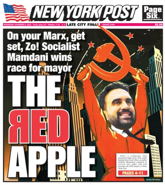 New York Post newspaper front page cover from November 2024 edition priced at 5 dollars features bold red text proclaiming The Red Red Apple with a central illustration of Zohran Mamdani a man with dark hair and beard wearing a suit and red tie raising his arms triumphantly holding a hammer and sickle symbol against a backdrop of New York City skyline including the Empire State Building and other buildings in red tones the layout includes American flags at top and bottom a small inset photo of Mamdani and text about his win as socialist mayor.