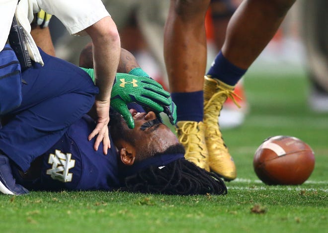 Jan 1, 2016; Glendale, AZ, USA; Notre Dame Fighting Irish linebacker Jaylon Smith (9) reacts in pain on the ground after suffering an injury in the first quarter against the Ohio State Buckeyes during the 2016 Fiesta Bowl at University of Phoenix Stadium. Mandatory Credit: Mark J. Rebilas-USA TODAY Sports