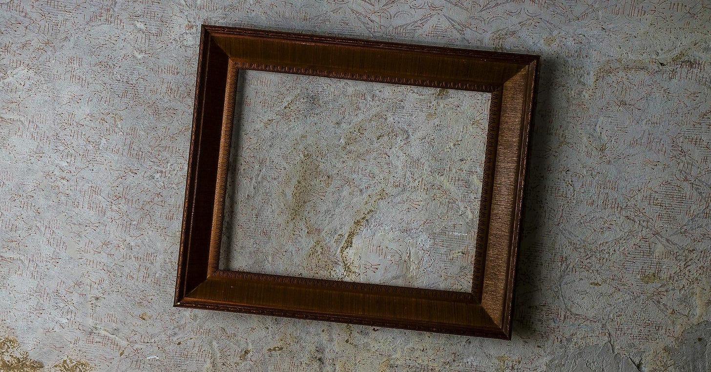 brown wooden frame on white wall