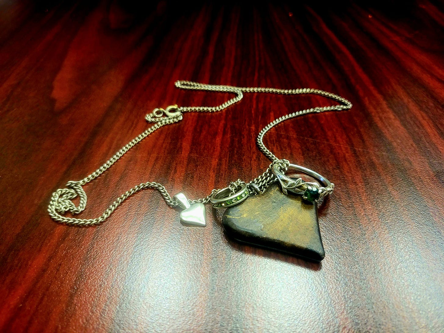 theseus ship necklace peridot charm and heart theseus ship necklace peridot charm and heart