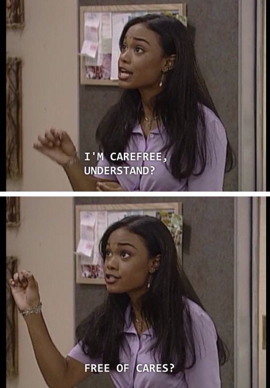 This may contain: an image of a woman talking to someone in front of a mirror that says i'm carefree, understand? free of cares?