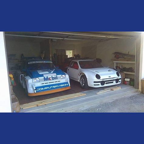 The RS200 without any livery or police markings being driven around a test track and in a garage next to a rally car.