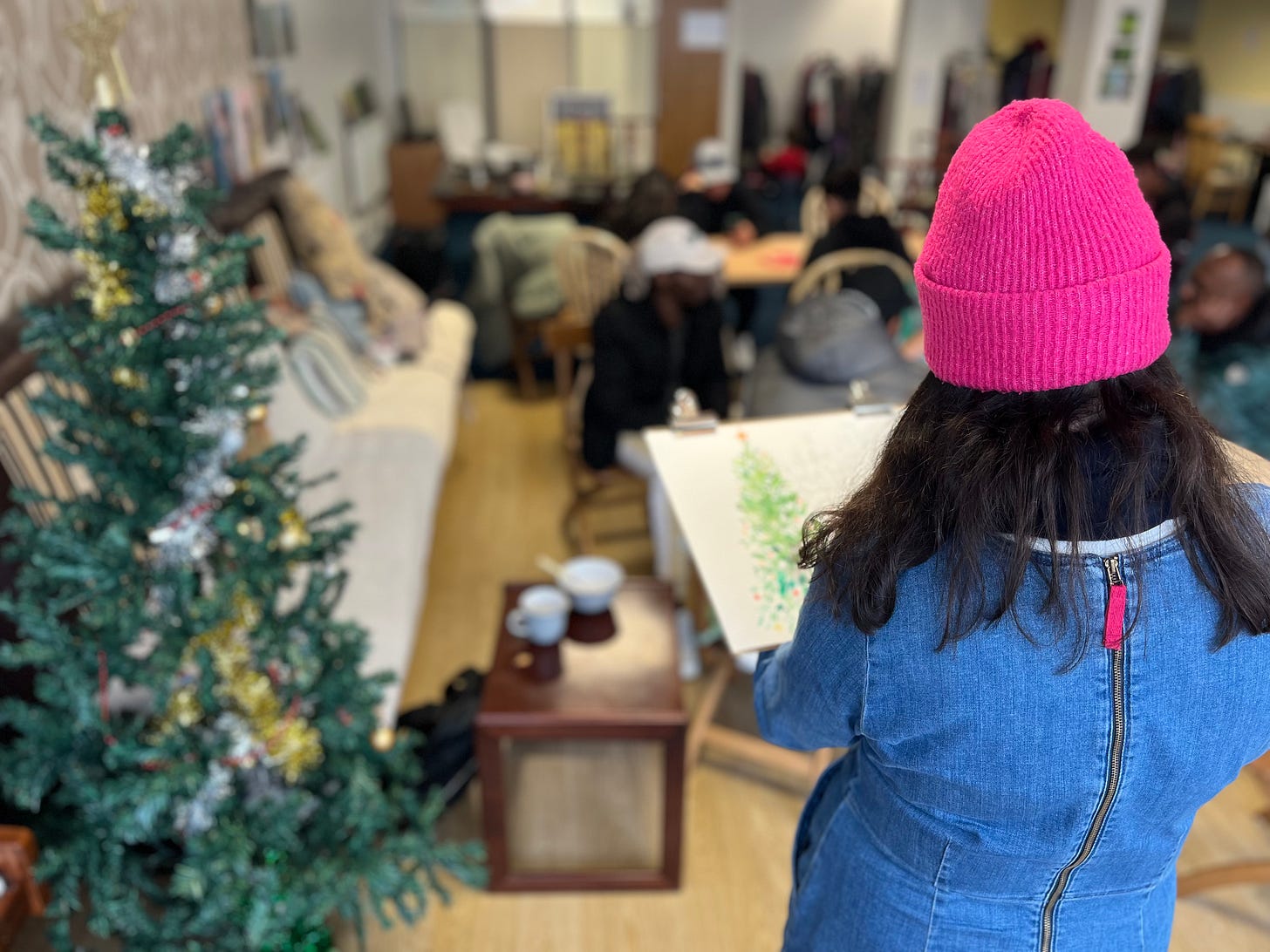 photo of Niki illustrating at  Refugee Centre