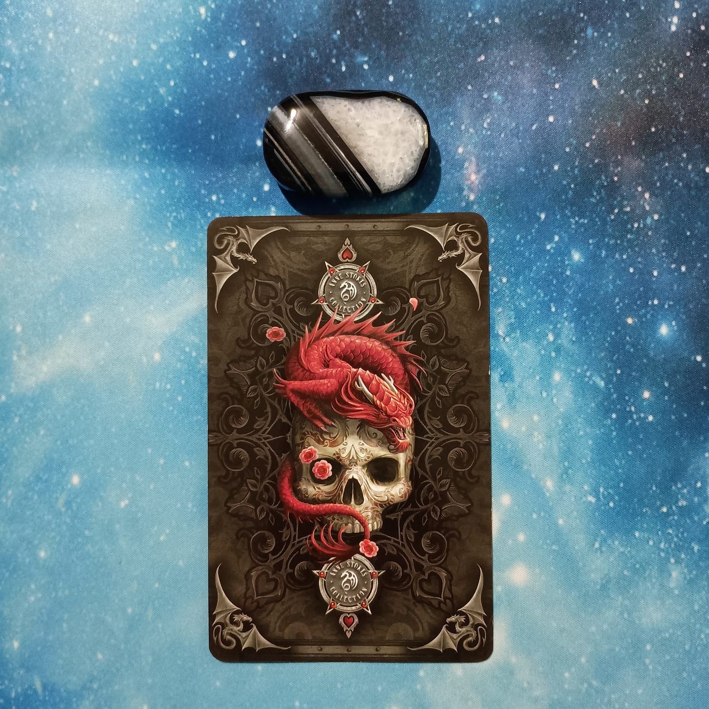 Full Moon Magic: Your August 2025 Pick-a-Card Tarot Reading, Pile 4, Black Agate crystal on a starry blue background, and 1 oracle card, face down Full Moon Magic: Your August 2025 Pick-a-Card Tarot Reading, Pile 4, Black Agate crystal on a starry blue background, and 1 oracle card, face down