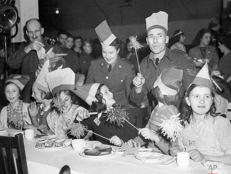 Black and white images of Christmas parties for children during the Second World War