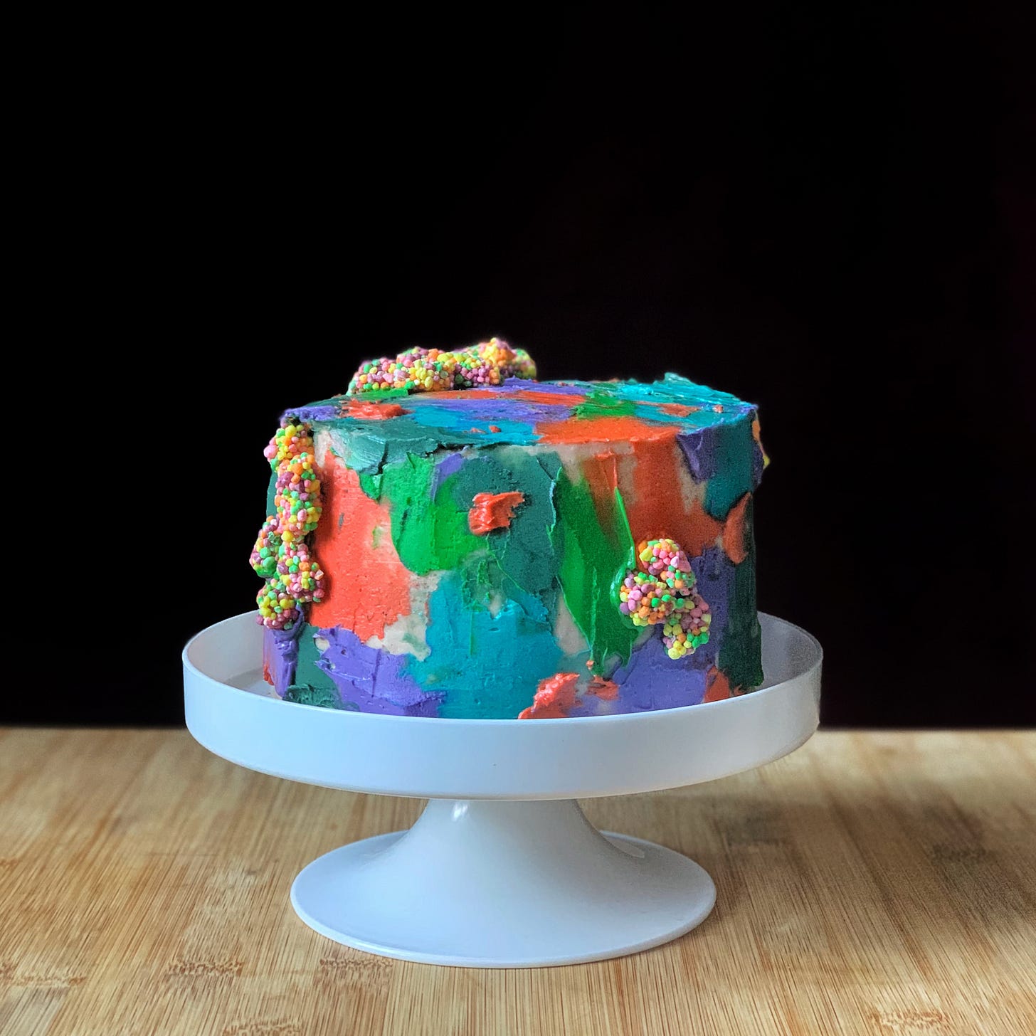 spiced white cola cake, rum &amp; coke cake soak, whipped twizzler ganache, caramelized fruity poprock brittle, malted popcorn buttercream, nerds clusters