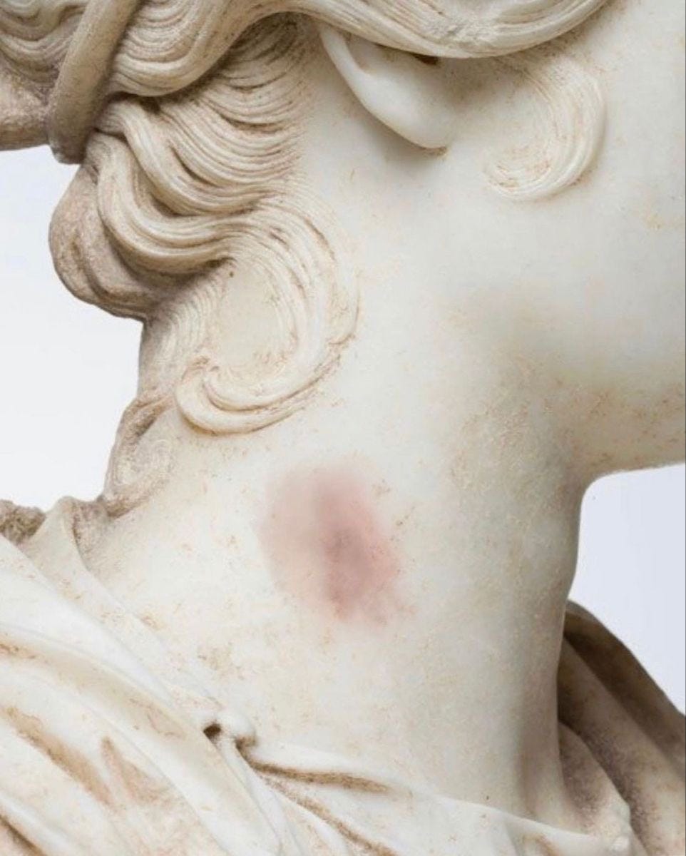 a marble statue that looks like it has a hickey