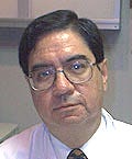 A person wearing glasses and a white shirt

Description automatically generated