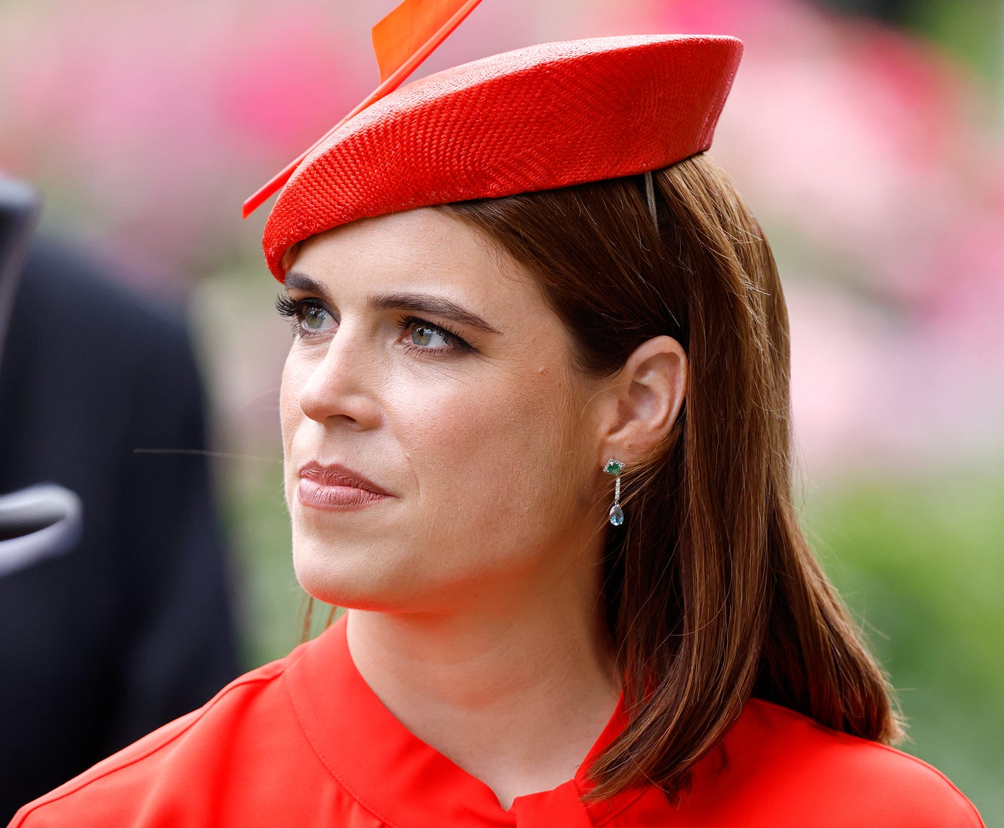 Princess Eugenie in an orange top and orange hat