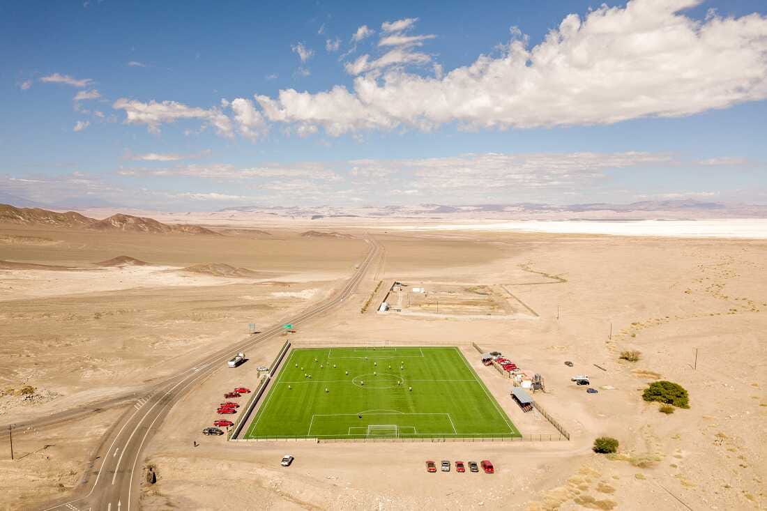 A football court, paid by lithium companies, in the indiginous community of Peine, the closest town to the lithium mining operations, in the Atacama Salt Flat on Saturday 12 of April, 2024. Antofagasta, Chile.